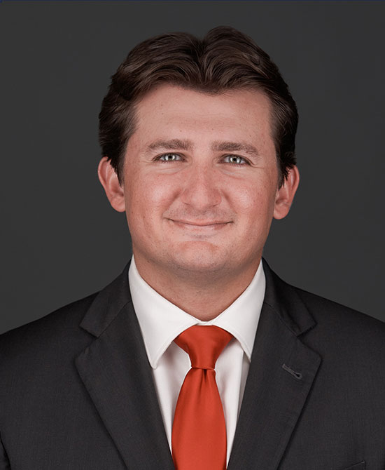 Man in a suit with a red tie