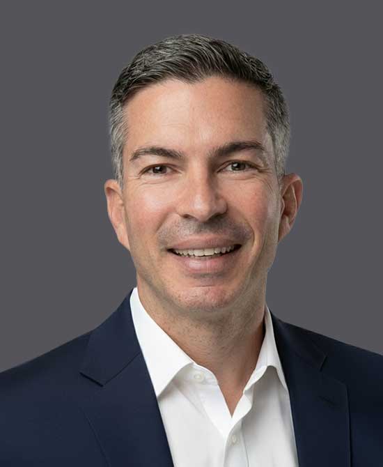 Man in a white shirt and suit jacket