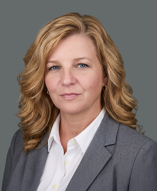 Woman in a grey suit